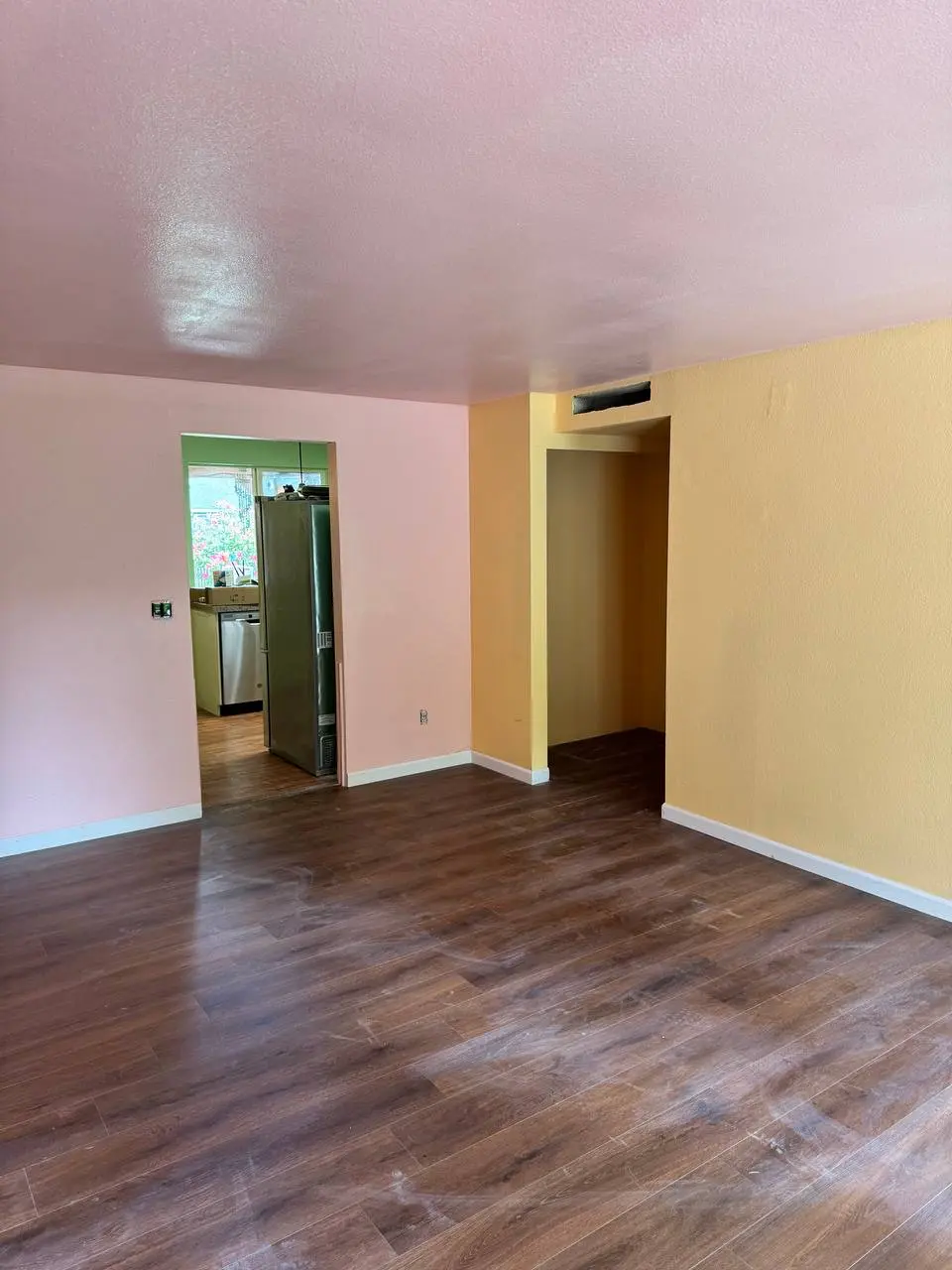 Bold color interior painting featuring pink walls and open floor plan in Shoreline