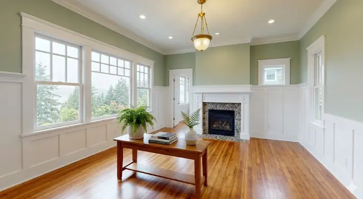 After photo of the same Edmonds Washington craftsman home interior showing stunning transformation with fresh warm white walls, crisp bright trim and modern color scheme