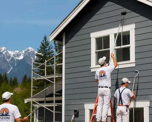 Professional painters working on house exterior in Washington