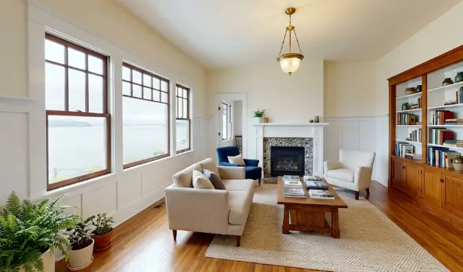 Freshly painted craftsman interior living room in an Edmonds WA home showing warm colors, precise trim work and beautiful natural Pacific Northwest light