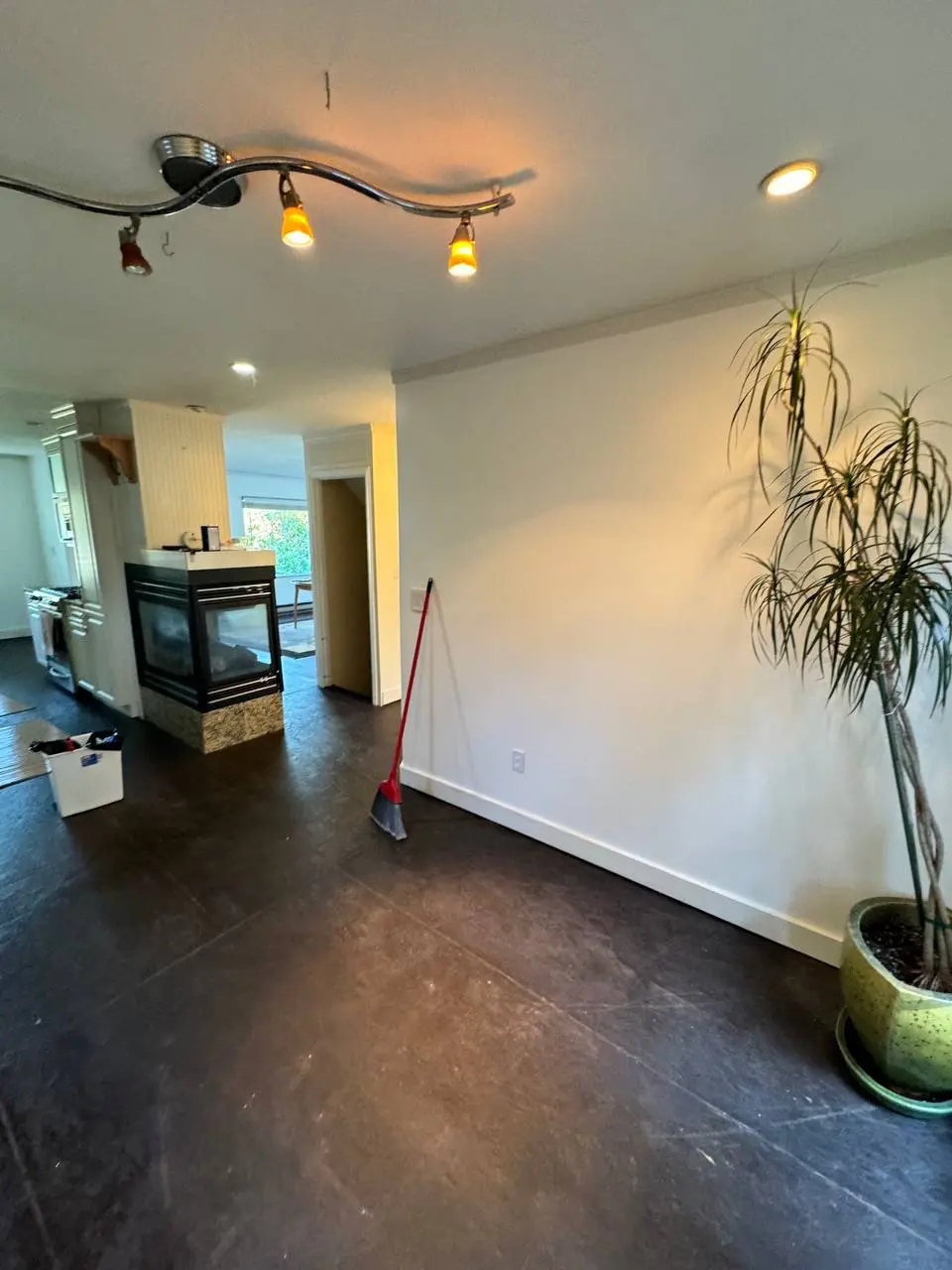 Living room ceiling painting completed in Bellevue with fireplace and modern lighting