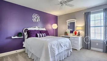 Teen bedroom painting transformation in Shoreline with purple accent wall